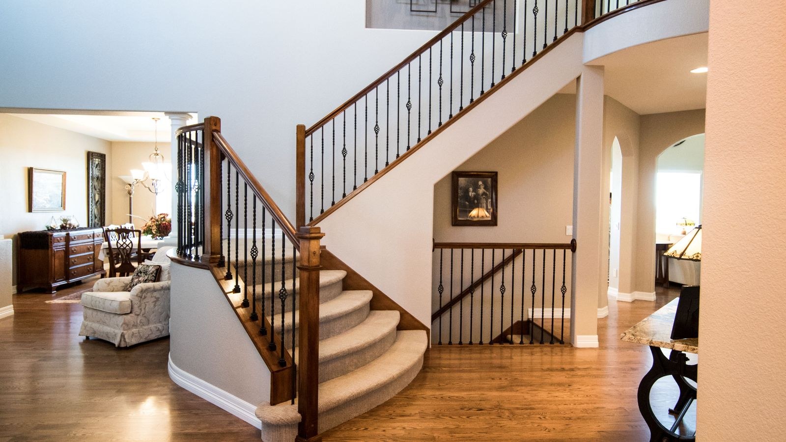 Open staircase in a two story house showing the vertical path Wi-Fi signal travels between floors