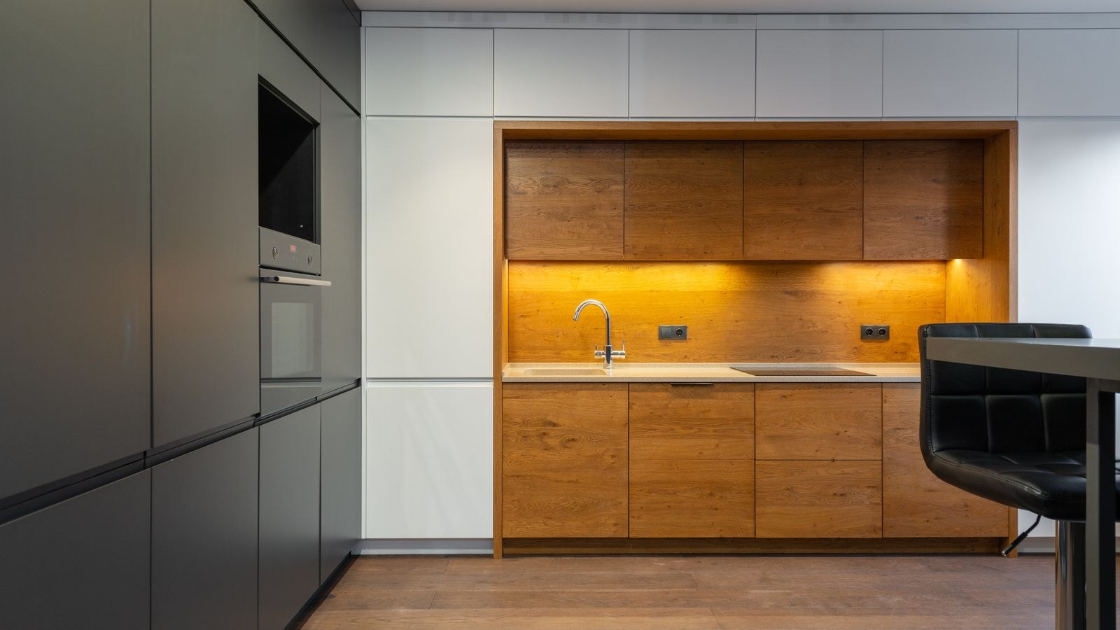 Contemporary kitchen with wood accents and bright even counter illumination