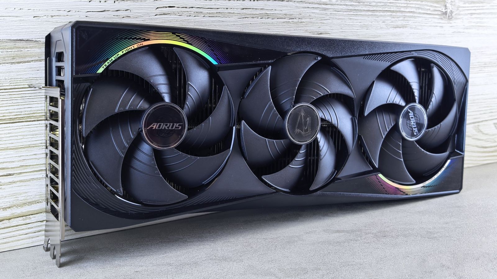 Triple fan GPU with RGB lighting installed in a gaming computer