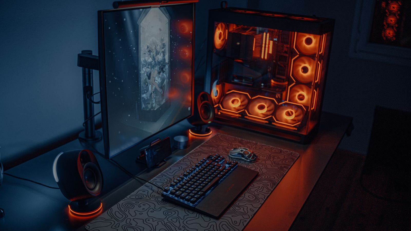 Gaming desk setup safeguarded by uninterruptible power supply protection