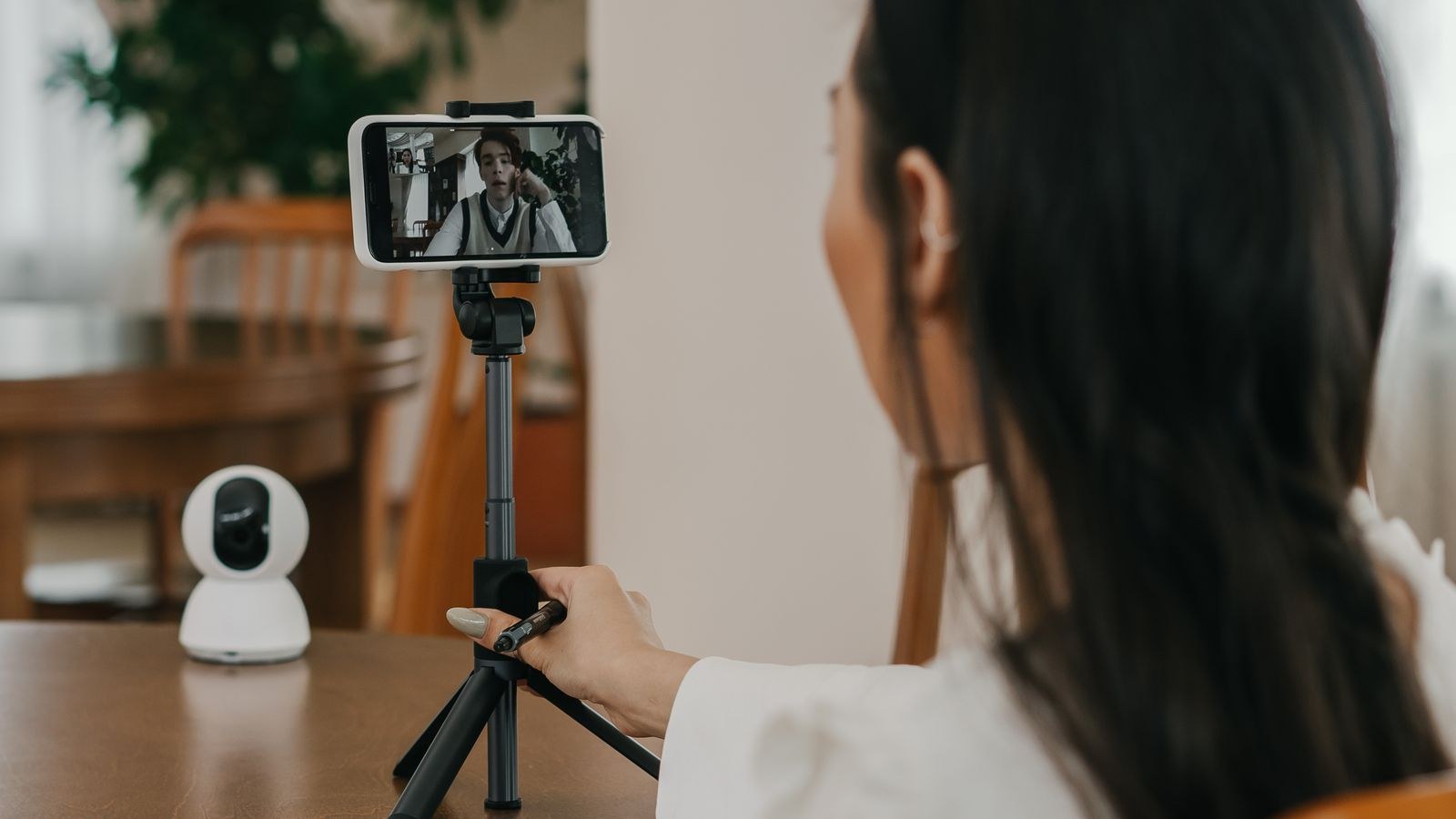 Smartphone mounted on a stand being used for a video call