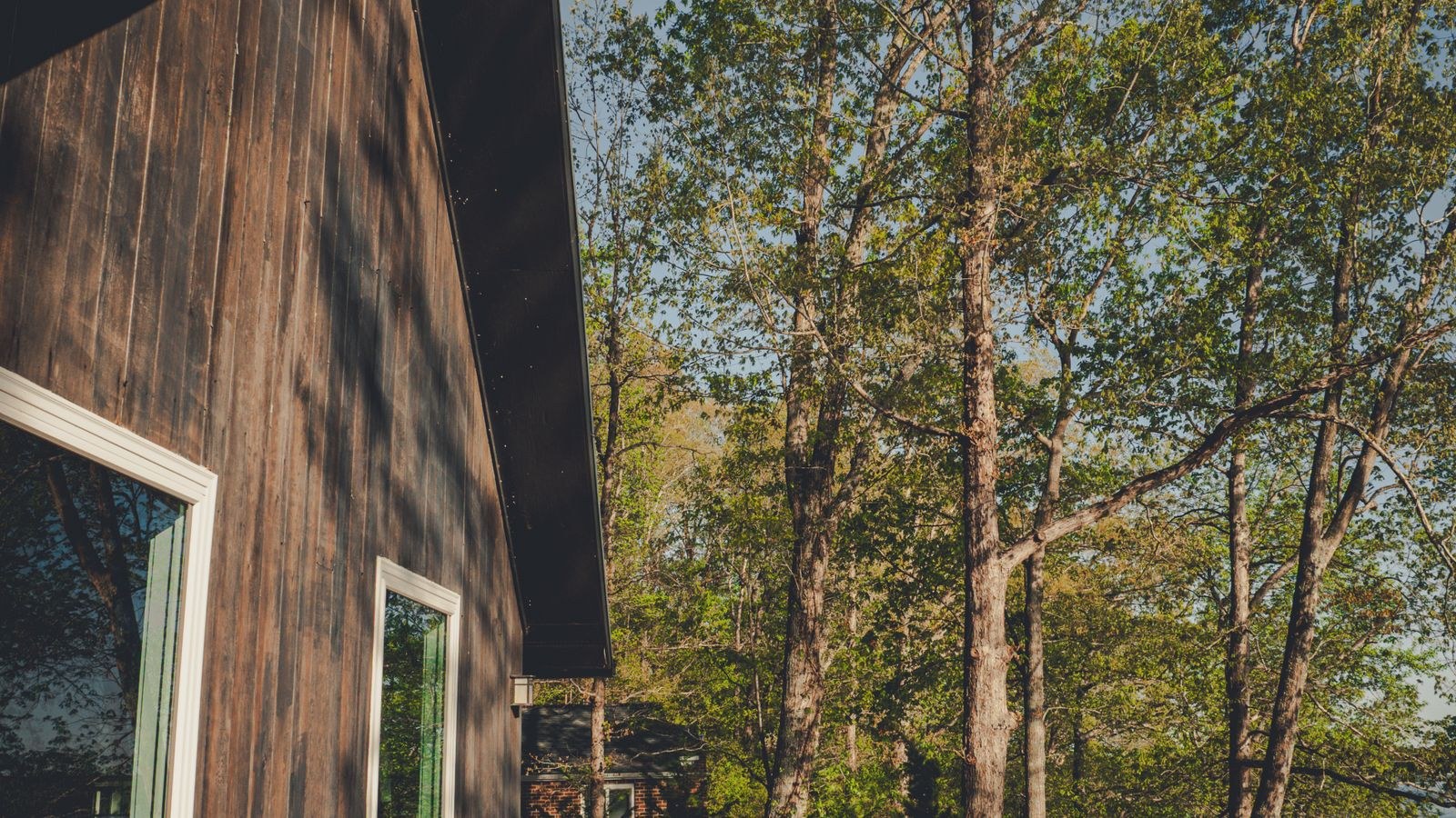 Modern cabin with a deck used as a second home requiring remote monitoring