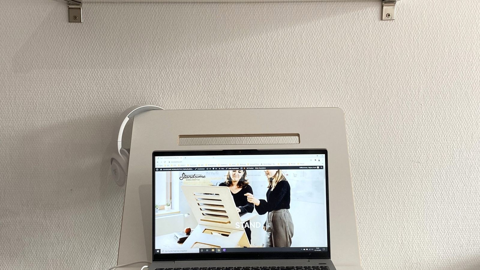 Compact home office workspace with a floating shelf above the desk surface