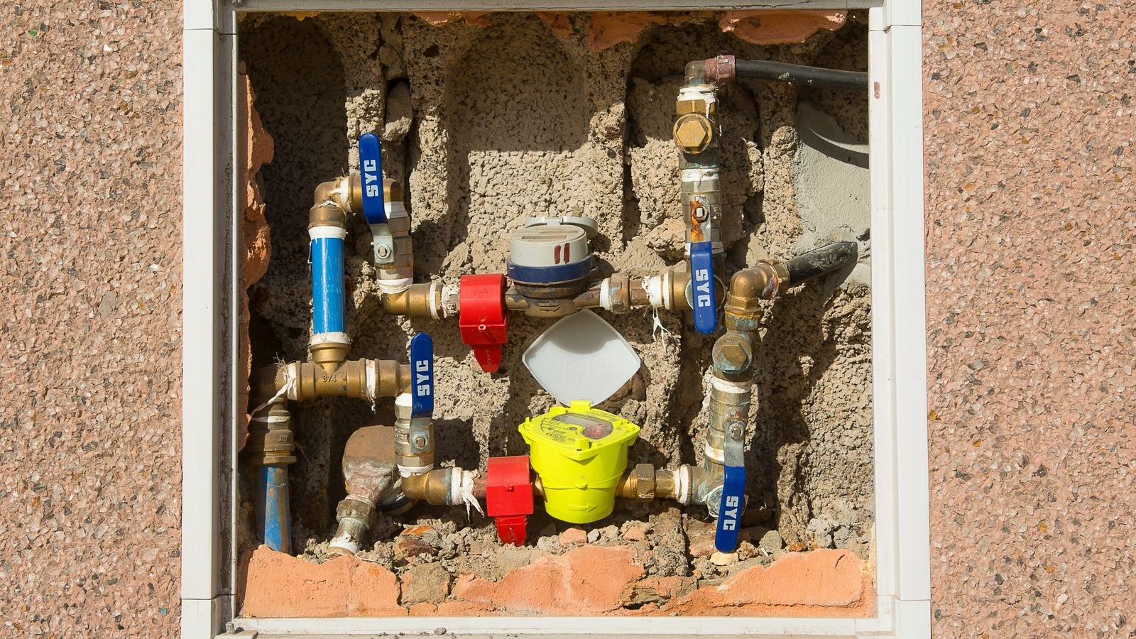 Home water meter and supply pipes where a whole house leak monitor is installed