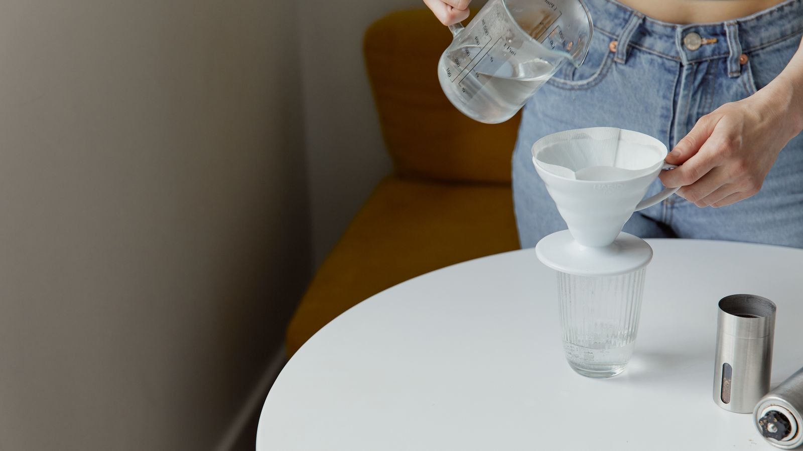 Under sink water filtration system installed in a kitchen cabinet