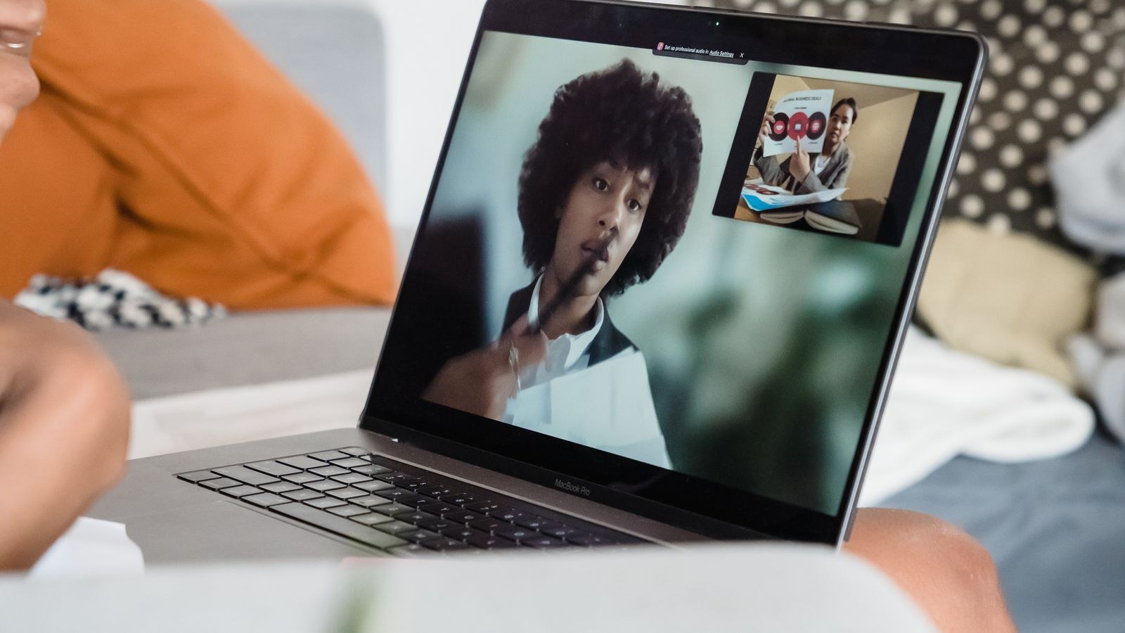 Laptop screen showing a video conference call during remote work