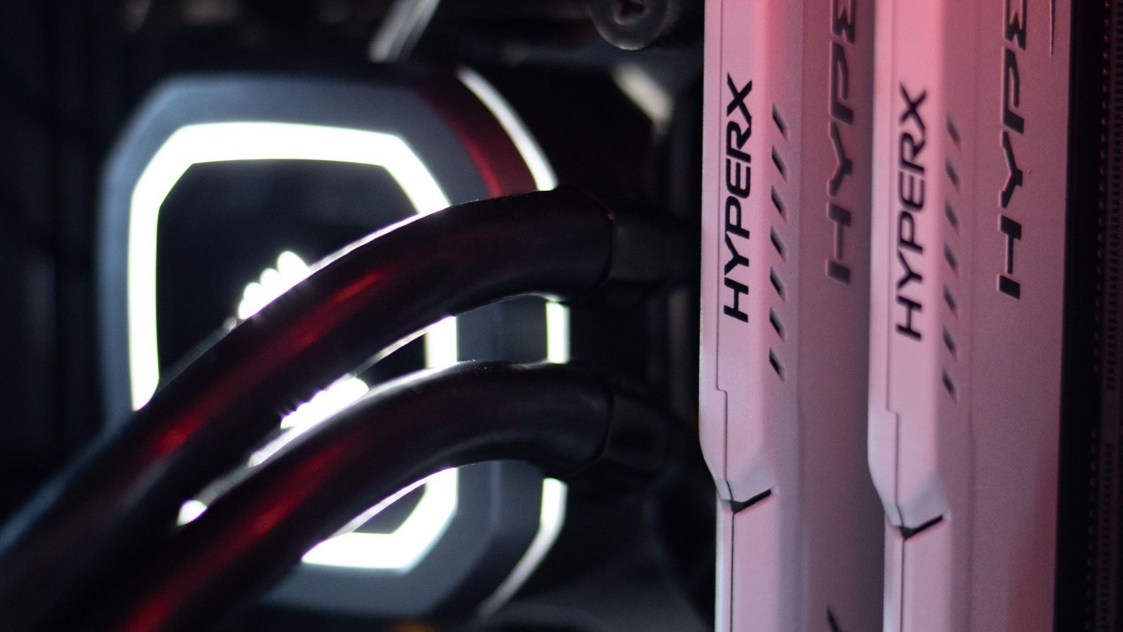 Finished white PC build with coordinated lighting and cable management