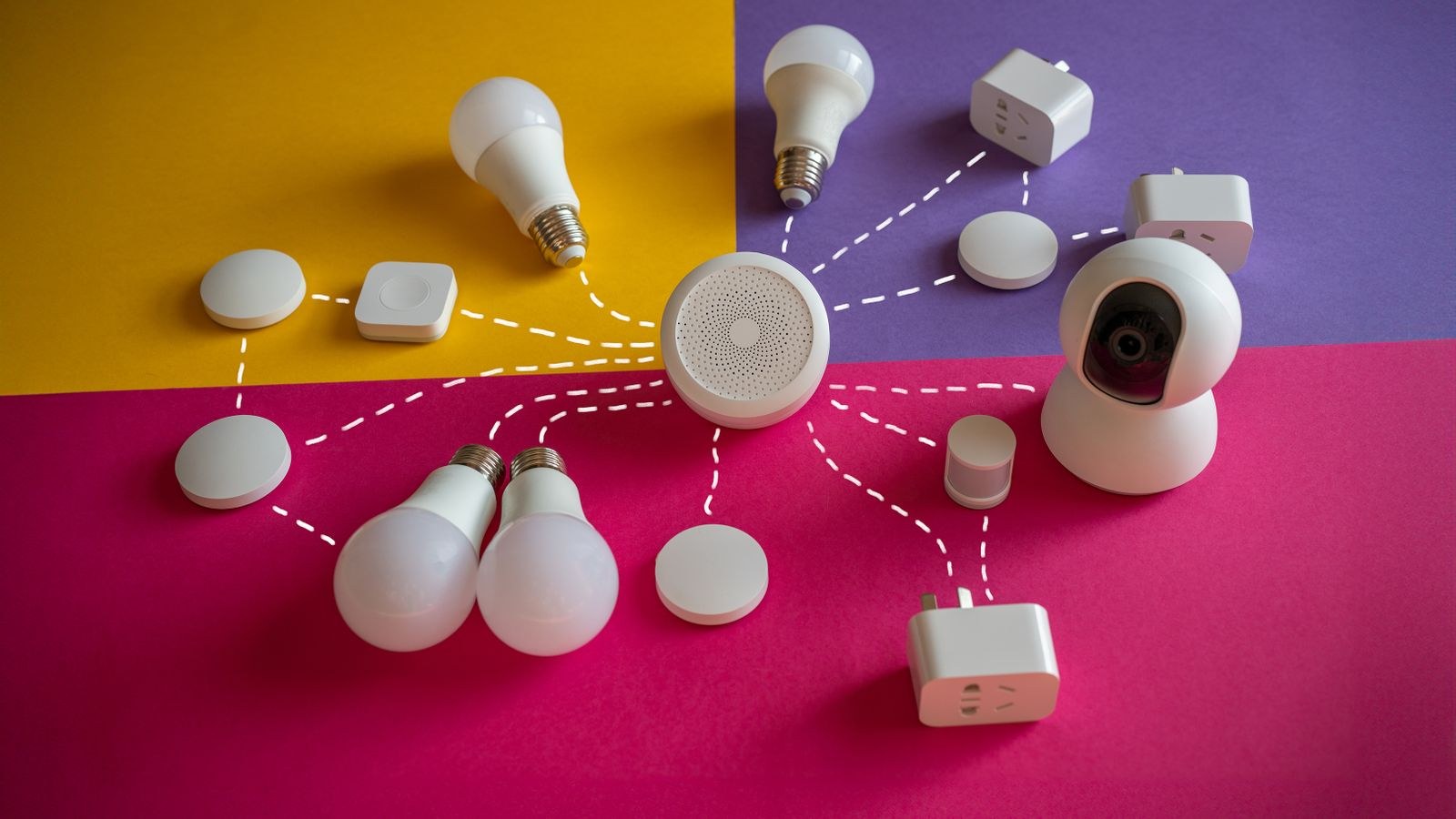 Connected smart home devices including bulbs and sockets on a bright backdrop