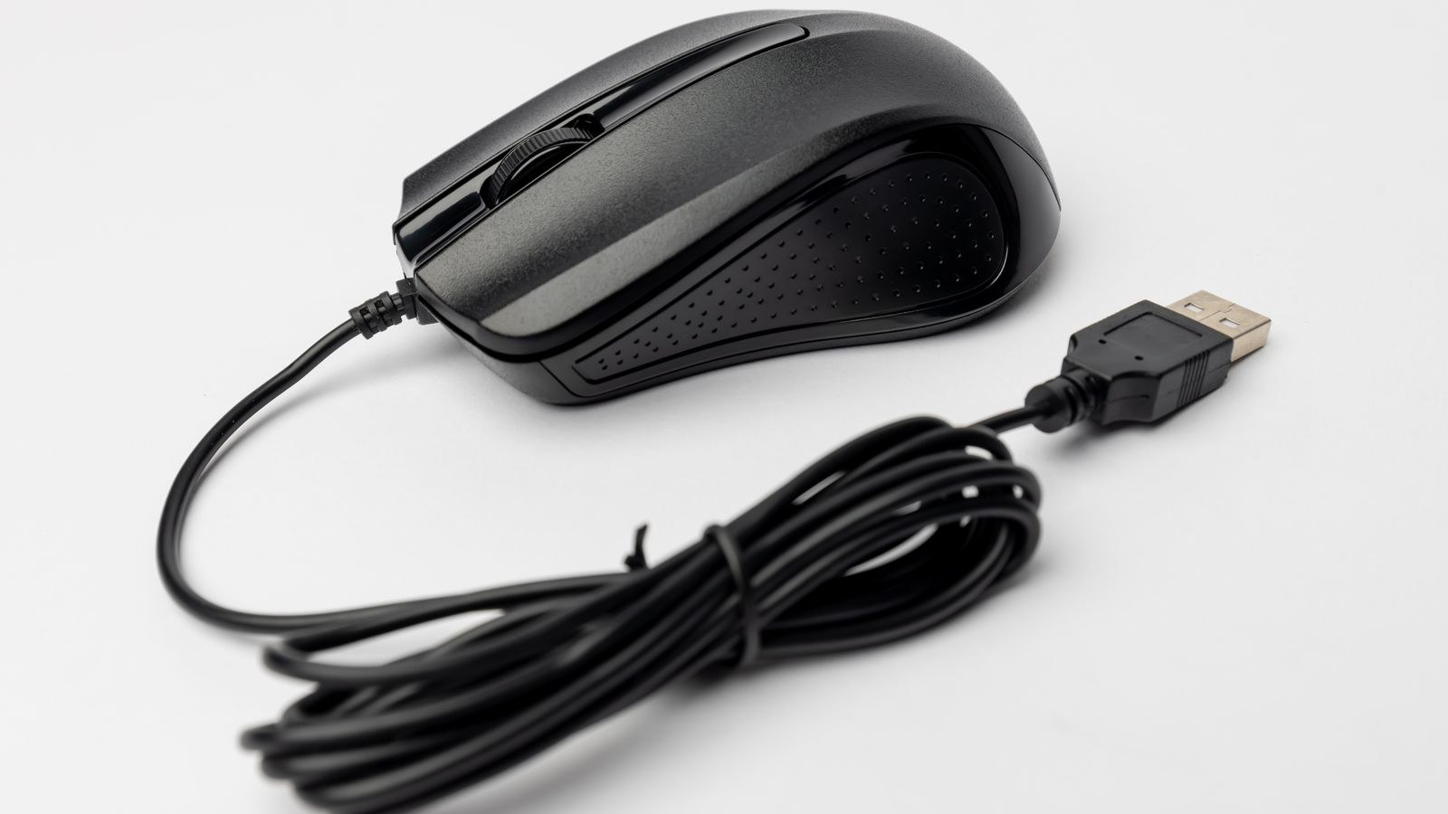 Black wired USB computer mouse on a plain white background